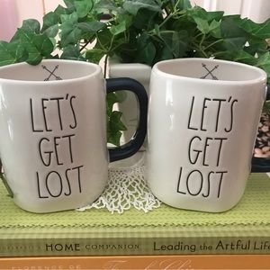 TWO RAE DUNN MUGS.. “LET’S GET LOST “